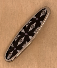black and white enameled, glass and silver oval pin