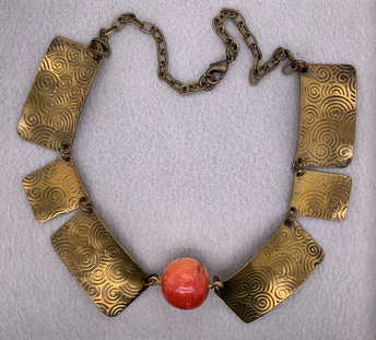 Spiral Printed Brass Necklace with Coral Orange Bead